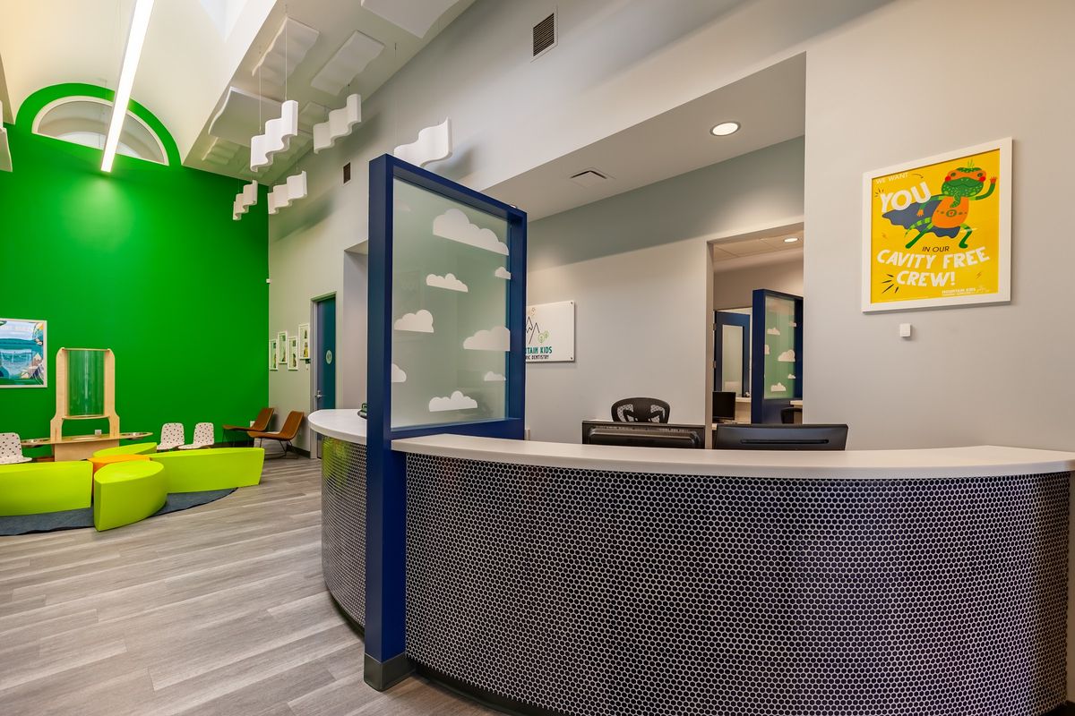 Curved reception desk for a pediatric office by J&M Custom Cabinet Shop