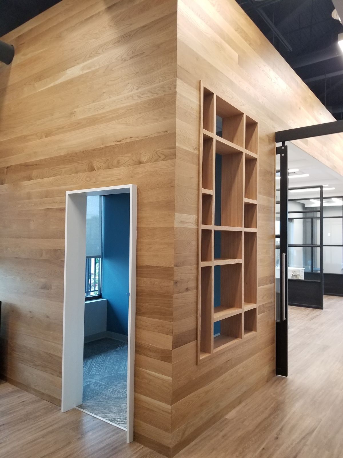 Wood walls and built-ins by J&M Custom Cabinet Shop